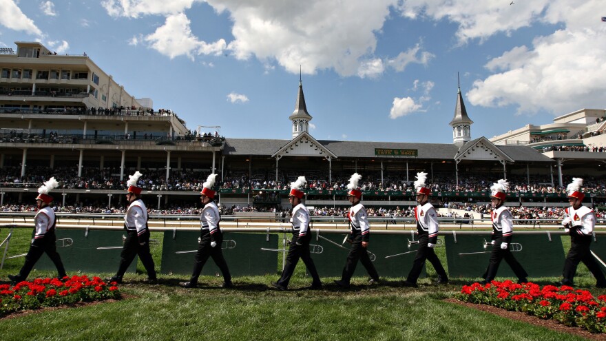 The University of Louisville's marching band leaves the Churchill Downs infield after performing the state song at the Kentucky Derby.