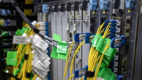 Cables connect to servers at Equinix’s data center in Billerica, Mass.  (Robin Lubbock/WBUR)