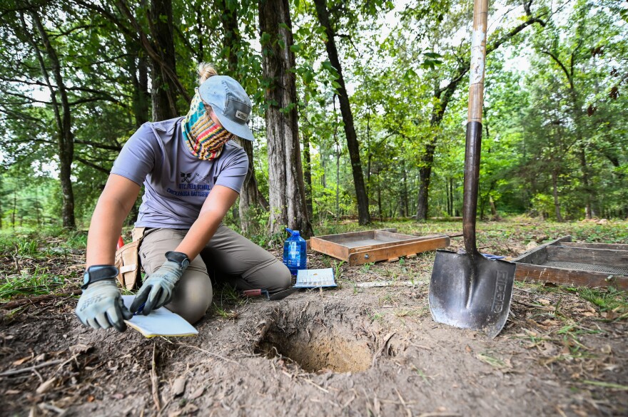 Dr. Morgan Smith screens sediment for student Emma Blanton during UTC's Archaeological Field Methods course