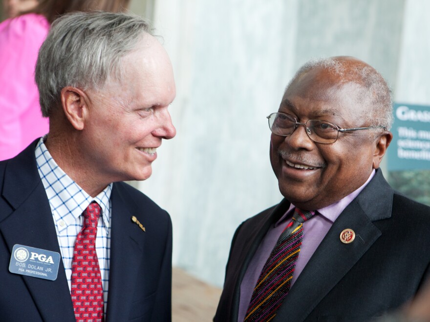 South Carolina Rep. James Clyburn talks with PGA professional Bob Dolan Jr. at the National Golf Day event on Capitol Hill. Clyburn is an avid golfer, and the Democrat says that earlier on in his career, he learned a lot about bipartisanship on the golf course.