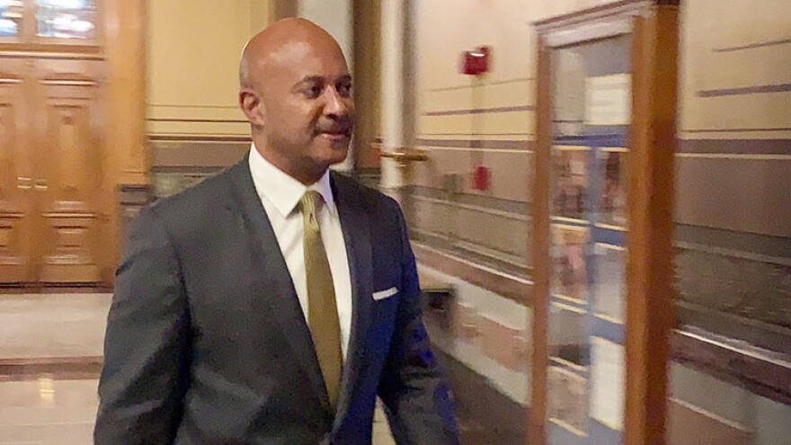 Attorney General Curtis Hill walks into the Indiana Supreme Court courtroom during the second day of his attorney disciplinary hearing.
