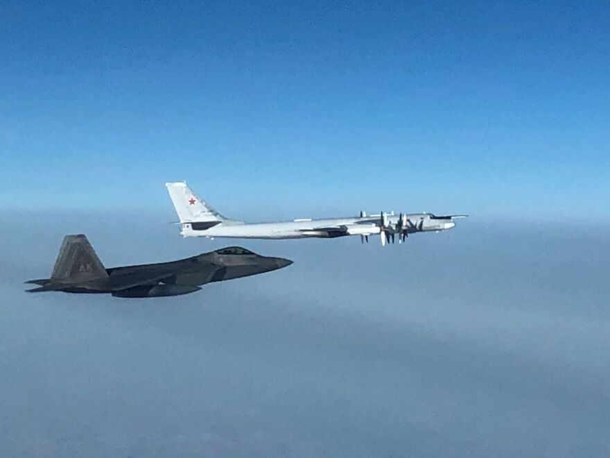 A U.S. F-22 fighter from JBER escorts a Russian Tu-95 bomber Thursday in the skies off Alaska. The bomber was one of five aircraft that transited international airspace