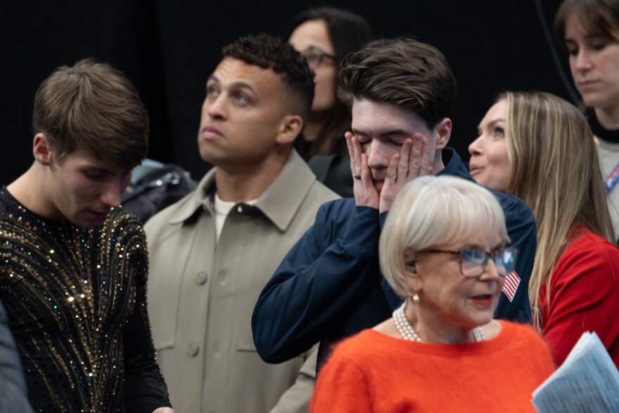 Maxim Naumov, rights, rubs his face while waiting for results in the men’s championship during the 2026 U.S. Figure Skating Championships at the Enterprise Center on Saturday, Jan. 10, 2026, in St. Louis’ Downtown West neighborhood.