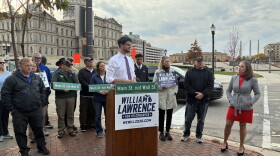 Will Lawrence with a crowd behind him.
