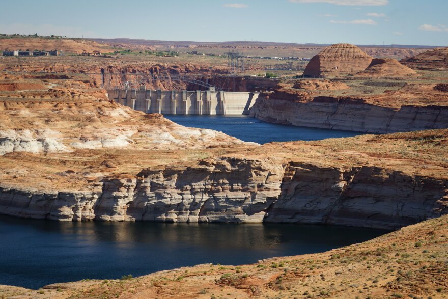 A distant view of Glen Canyon Dam looking across Lake Powell in the Glen Canyon Recreation Area, April 24, 2024.