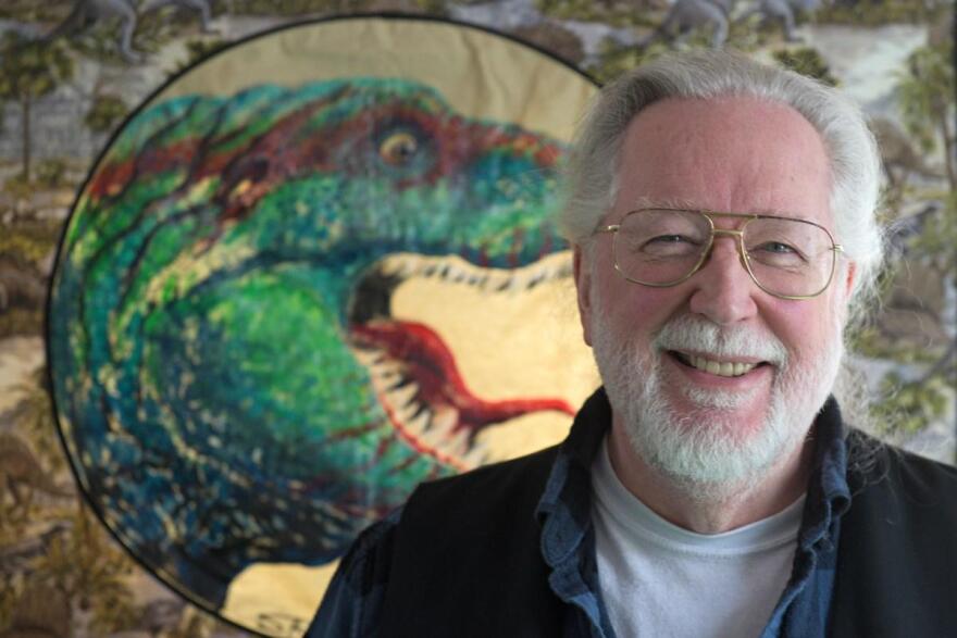 Stephen R. Bissette, photographed at his home in Windsor, Vt., with a quilt depicting "TYRANT®," a tyranosaurus rex character he created, on Tuesday, March 24, 2026, will be named the state's cartoonist laureate on April 9 in Montpelier. (Valley News photo)