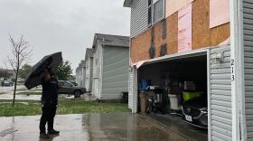 Ralph Clarett surveys the damage to his Belton home after a tornado hit south-central Jackson County on Friday night.