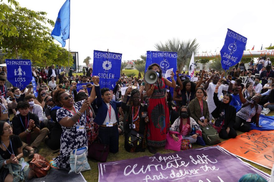 Demonstrators participate in a sit-in calling for reparations for loss and damage at the COP27 U.N. Climate Summit.