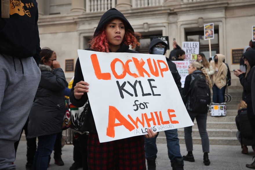 Demonstrators gather outside of the Kenosha County Courthouse as the jury deliberates for a second day in the trial of Kyle Rittenhouse on Nov.17, 2021.