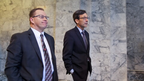 Superintendent of Public Instruction Chris Reykdal walks with former Attorney General Bob Ferguson.