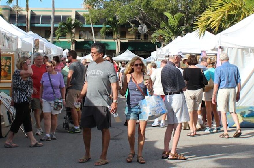 Visitors take in art during Naples Art in the Park