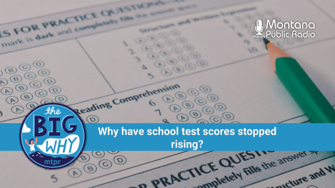 Close-up of a standardized test answer sheet with multiple-choice bubbles and a green pencil filling in answers. A blue banner across the image reads, “Why have school test scores stopped rising?” with Montana Public Radio and “The Big Why” logos displayed.