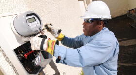 Installing a smart meter in Portland, Oregon, 2009.