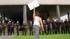 A demonstrator protests the verdict in the trial of four Los Angeles police officers accused of beating motorist Rodney King outside the Los Angeles Police Department.