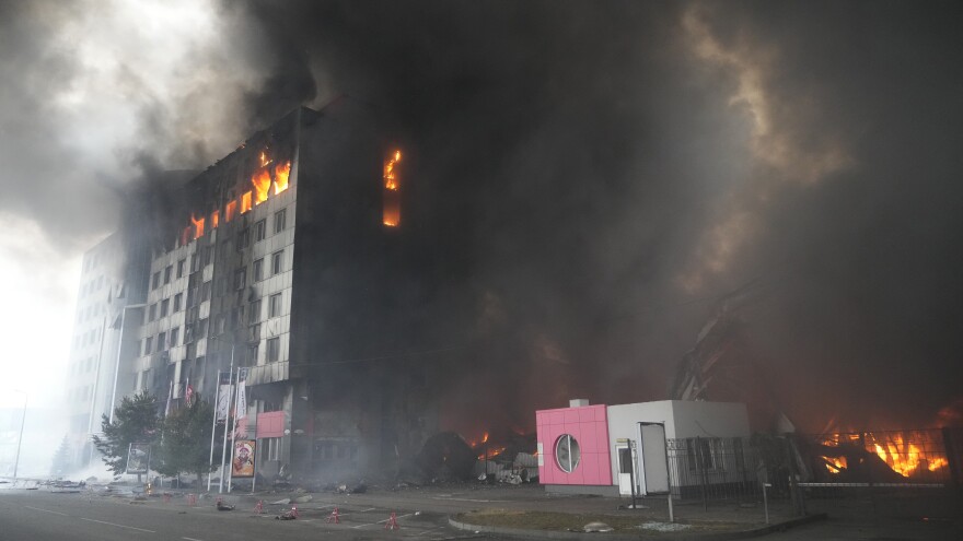 A building burns after shelling in Kyiv, Ukraine, March 3, 2022. Russian forces have escalated their attacks on crowded cities in what Ukraine's leader called a blatant campaign of terror.