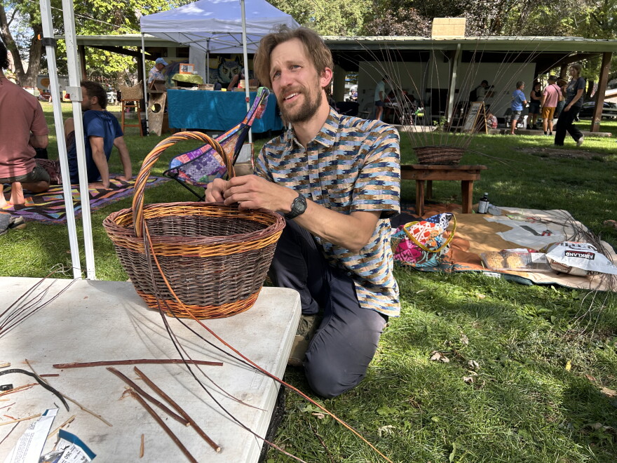 Artist Jeff Wagner weaving a basket at Mountain Harvest Festival.