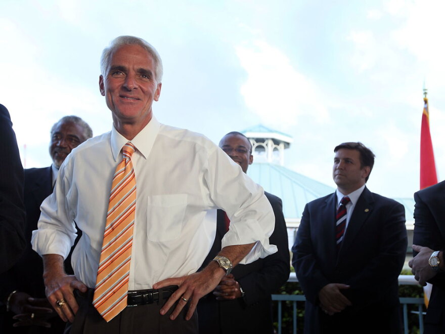 Florida Gov. Charlie Crist (left) attends a December bill-signing ceremony in Fort Lauderdale.