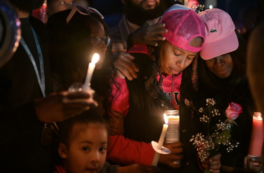 La'Nyiah 'Lala' Clark's adoptive mother Ameerah Woods, center, and adoptive grandmother Carmen Tinson comfort each other Saturday evening, Feb. 28, 2026, at a vigil to remember the Wilkes-Barre teen, whose remains were found near a garage off Thayer Street seven days earlier.