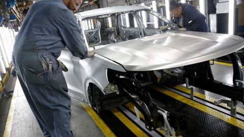 Workers assemble cars at Ford's newly renovated assembly plant in Chicago. Factories lost 12,000 jobs in December. The manufacturing sector has been hard hit by the trade war as well as slowing demand overseas.