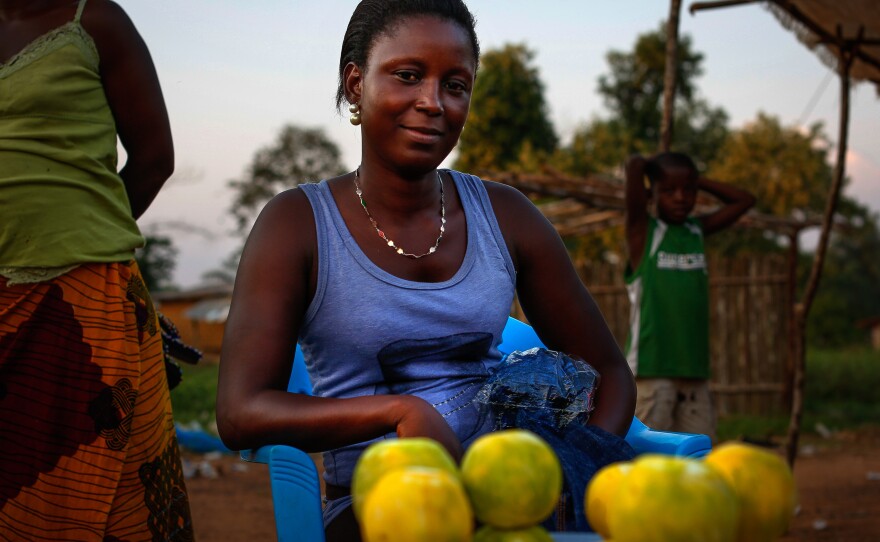 Just off Ganta's main street, 18-year-old orange seller Bebe Gono says she's struggling. "We are trying to find the little we can afford," she says.