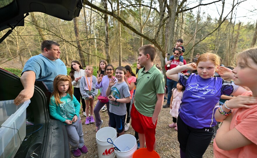 Fourth grade teacher Chris Hall explains to students and parents how they will release the trout into the South Branch of the Tunkhannock Creek.