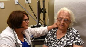 Jennifer Carnahan, MD of the Regenstrief Institute and Indiana University Center for Aging Research and Indiana University School of Medicine examines an Eskenazi Health patient.