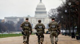 National Guard patrol along the National Mall in front of the Capitol on Wednesday, Nov. 26, 2025, in Washington, D.C.