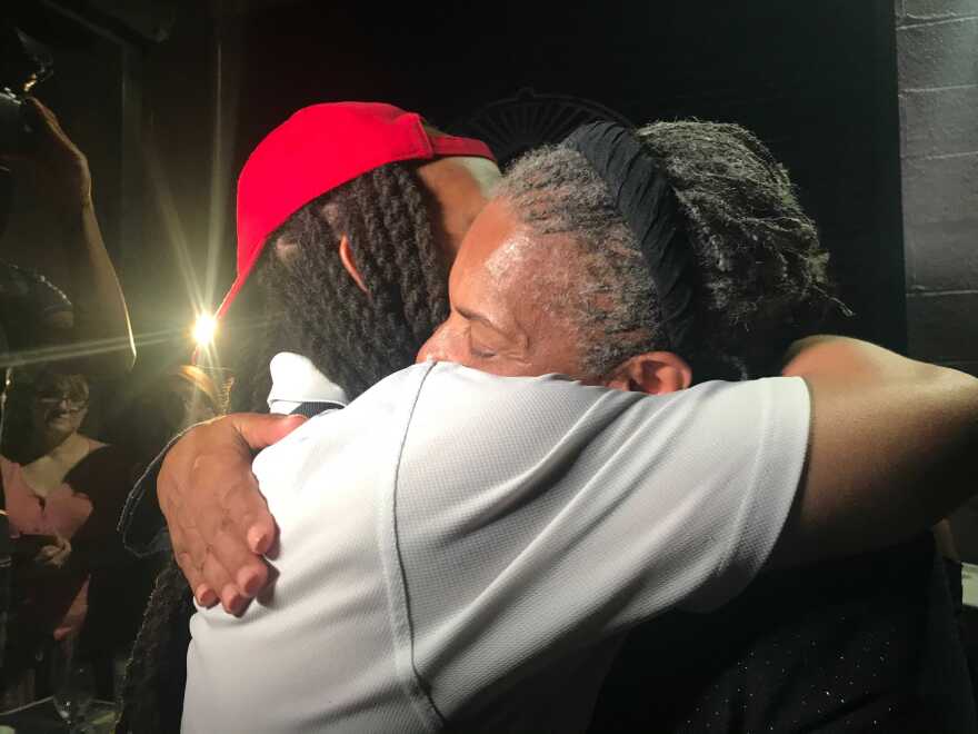 Deborah Peoples (right) gave lots hugs to supporters as she left her election night event.