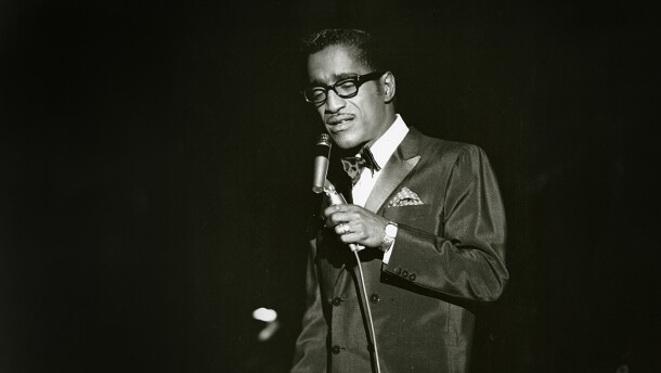 Sammy Davis Jr. singing onstage at the Sands Hotel in Las Vegas, most likely in the 1960s.
