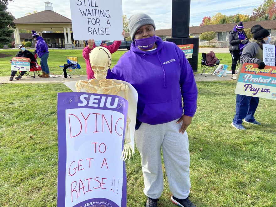 member of the SEIU holds sign while striking outdoors