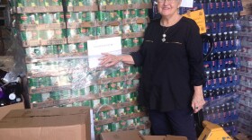 Executive director of Our Daily Bread Food Bank in Hammond, Myrna Jordan, stands in front of pallets of food in the warehouse. The food is distributed to 25 sites throughout the Tangipahoa Parish every week.