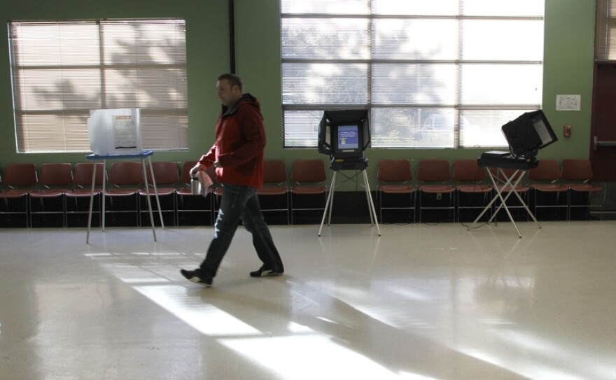 A man votes in at a Tacoma polling location last November. Pierce County's polling places are to be eliminated under a bill signed Tuesday by Gov. Chris Gregoire. It moves the state to vote-by-mail only.