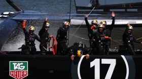 Oracle Team USA skippered by James Spithill celebrates after defending the cup as they beat Emirates Team New Zealand in the final race on Wednesday.