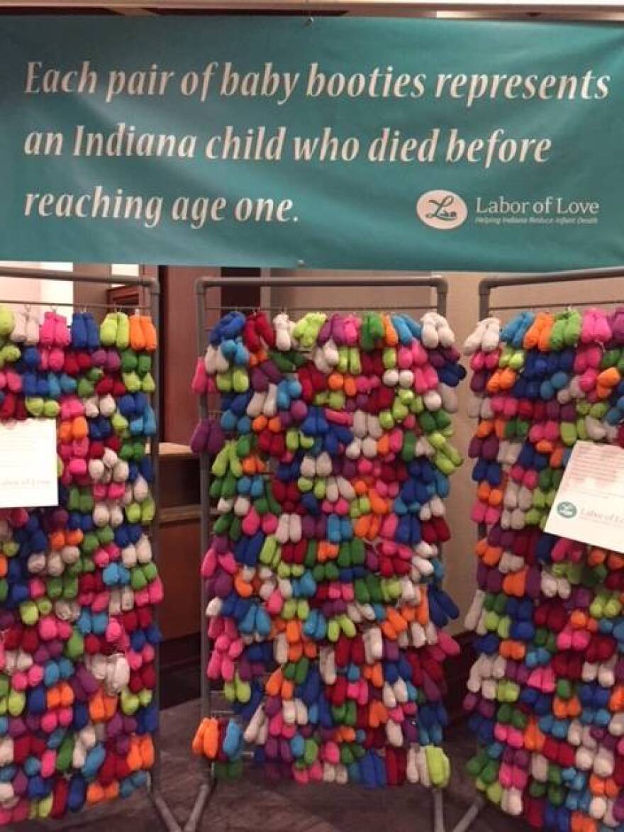 A display at the Indiana Labor of Love summit, each pair of booties represents a Hoosier child who died before their first birthday.