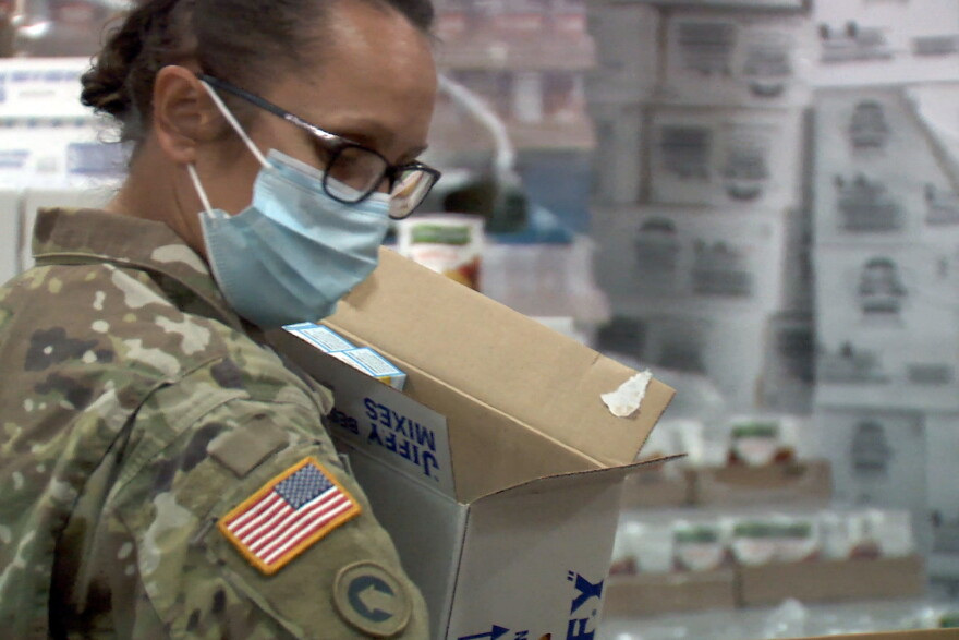 National Guardsman filling food pantry boxes