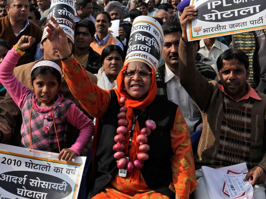 A protester at a rally in New Delhi last month wears a garland of onions  to protest a price increase in the Indian staple.