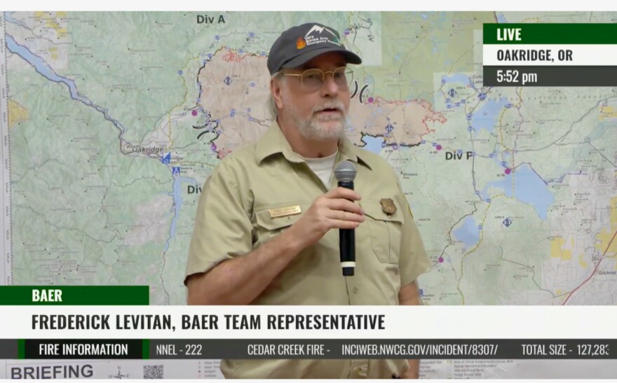 Fred Levitan speaks at a public meeting in Oakridge