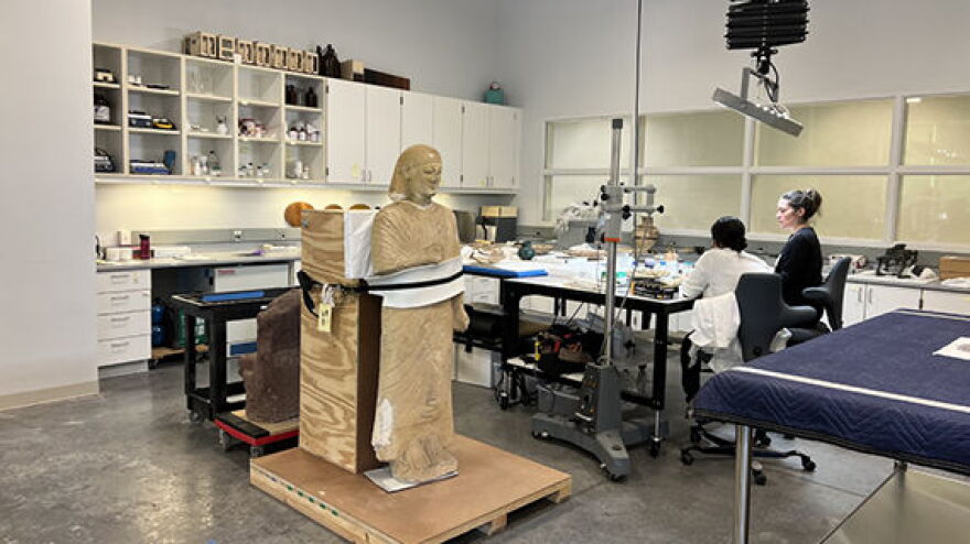 Photo of conservators at work at Ringling Museum.