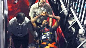 In this photo provided by the Las Vegas News Bureau, Indiana Pacers' Paul George is carted off the court after breaking his right leg during the USA Basketball Showcase intrasquad game in Las Vegas on Friday, Aug. 1.