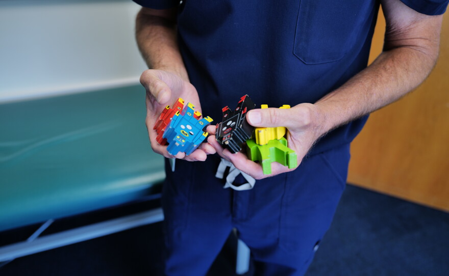 Ralph Northam holds colorful blocks he uses during neurological exams with pediatric patients.