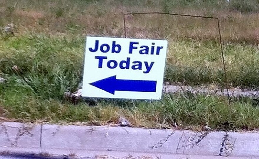 Sign directs people to Job Fair