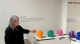 Director of Gallery and Outreach at NKU points to the opening of the exhibit Tactile Revolutions, called Meet the Team.