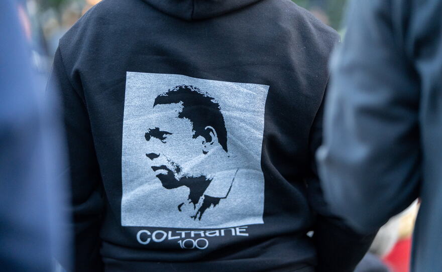 A fan sports a Coltrane 100 hoodie at A Love Park Supreme.