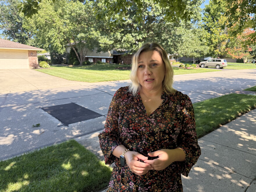 Ukrainian immigrant Tetiana stands on her street in Kettering, Ohio, discussing her struggles staying safely in the U.S. while her hometown suffers through war with Russia. 