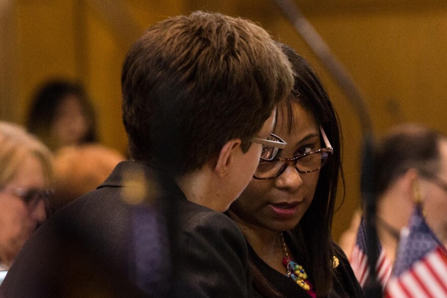 State Rep. Janelle Bynum, D-Clackamas (right) talks with House Speaker Tina Kotek, D-Portland, on the floor of the House at the Capitol in Salem, Oregon, Tuesday, April 2, 2019.