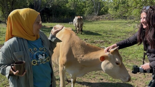 Dairy farmer Kenya Abraham talks with docuseries producer Erica Chambers.