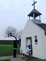 Two men pray at an early morning service at La Lomita chapel, a historical landmark in Mission, Texas.