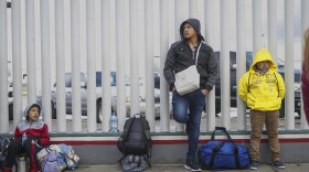 Honduran migrants wait in line to plead their asylum cases at the El Caparral border crossing on March 2, 2020 in Tijuana, Mexico. (Sandy Huffaker/Getty Images)
