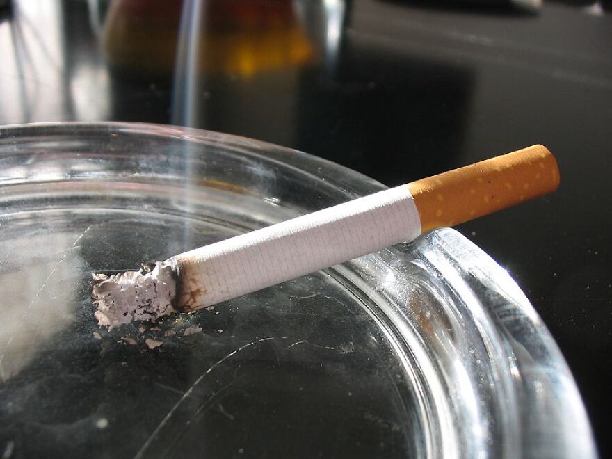 A cigarette in an ashtray.