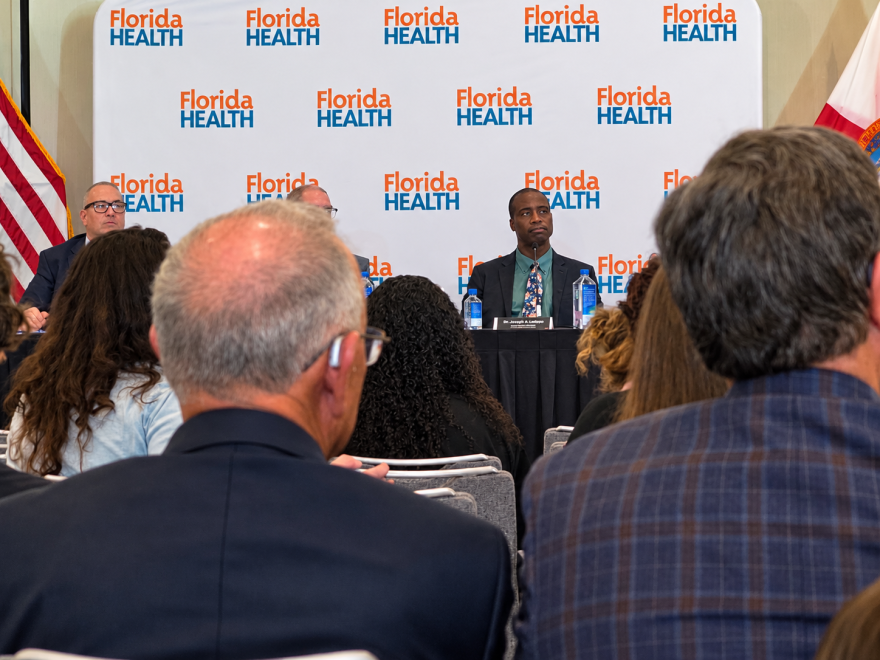 Surgeon General Dr. Joseph Ladapo during Thursday's public hearing at the Orlando Mariotte Lake Mary hotel, observing public comment on the state's new proposal to remove school entry vaccine mandates.
